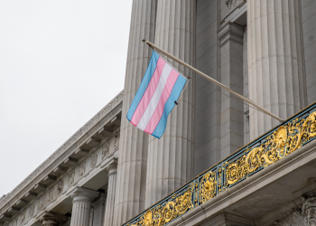 "Trans Pride Flag at SF City Hall 20230802-5461" by Pax Ahimsa Gethen is licensed under CC BY-SA 4.0.
