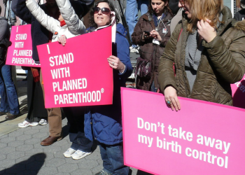 "I stand with Planned Parenthood" by ctrouper is licensed under CC BY 2.0.