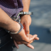 College professor arrested for bringing gun to ICE protest